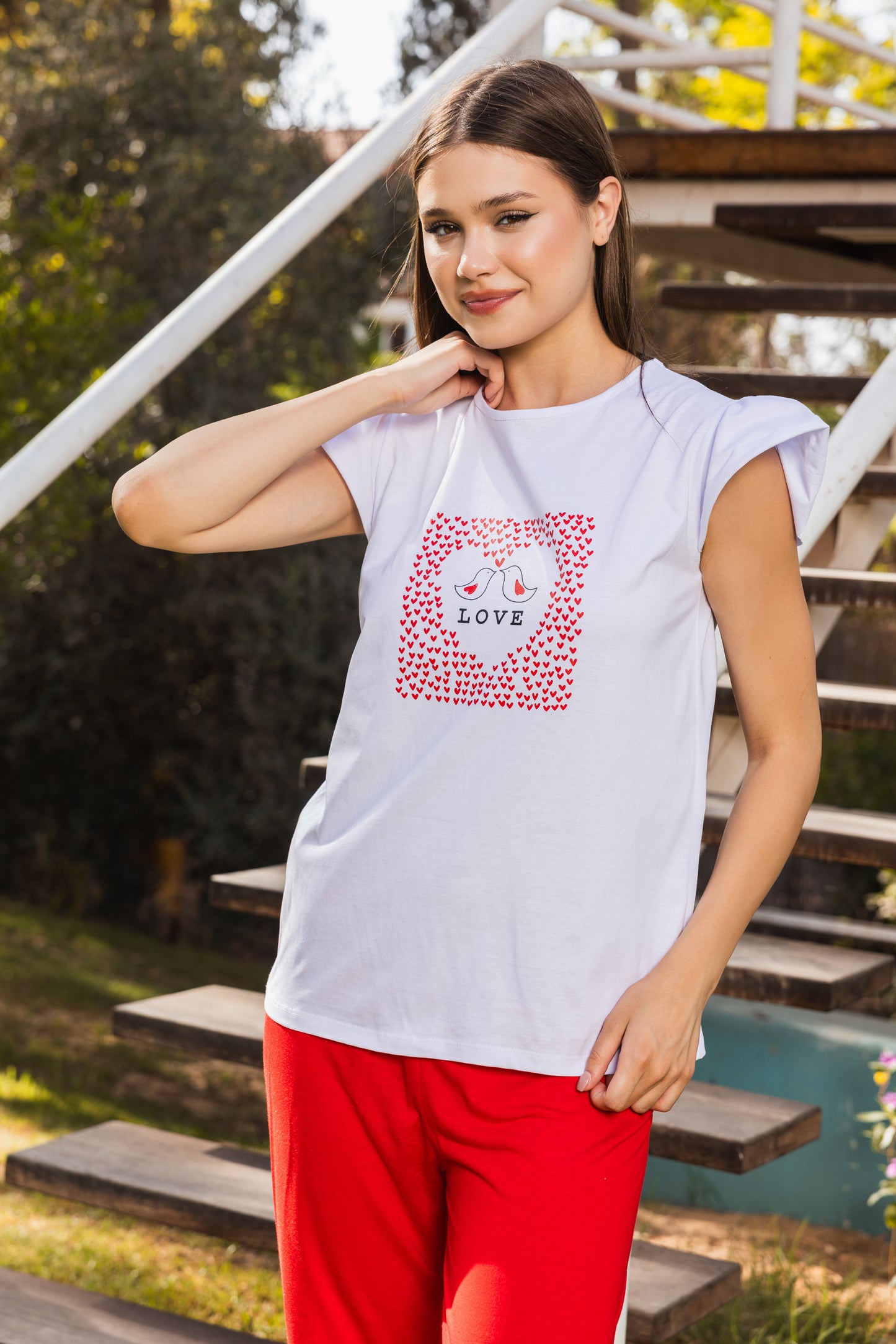 White printed top, plain red pants
