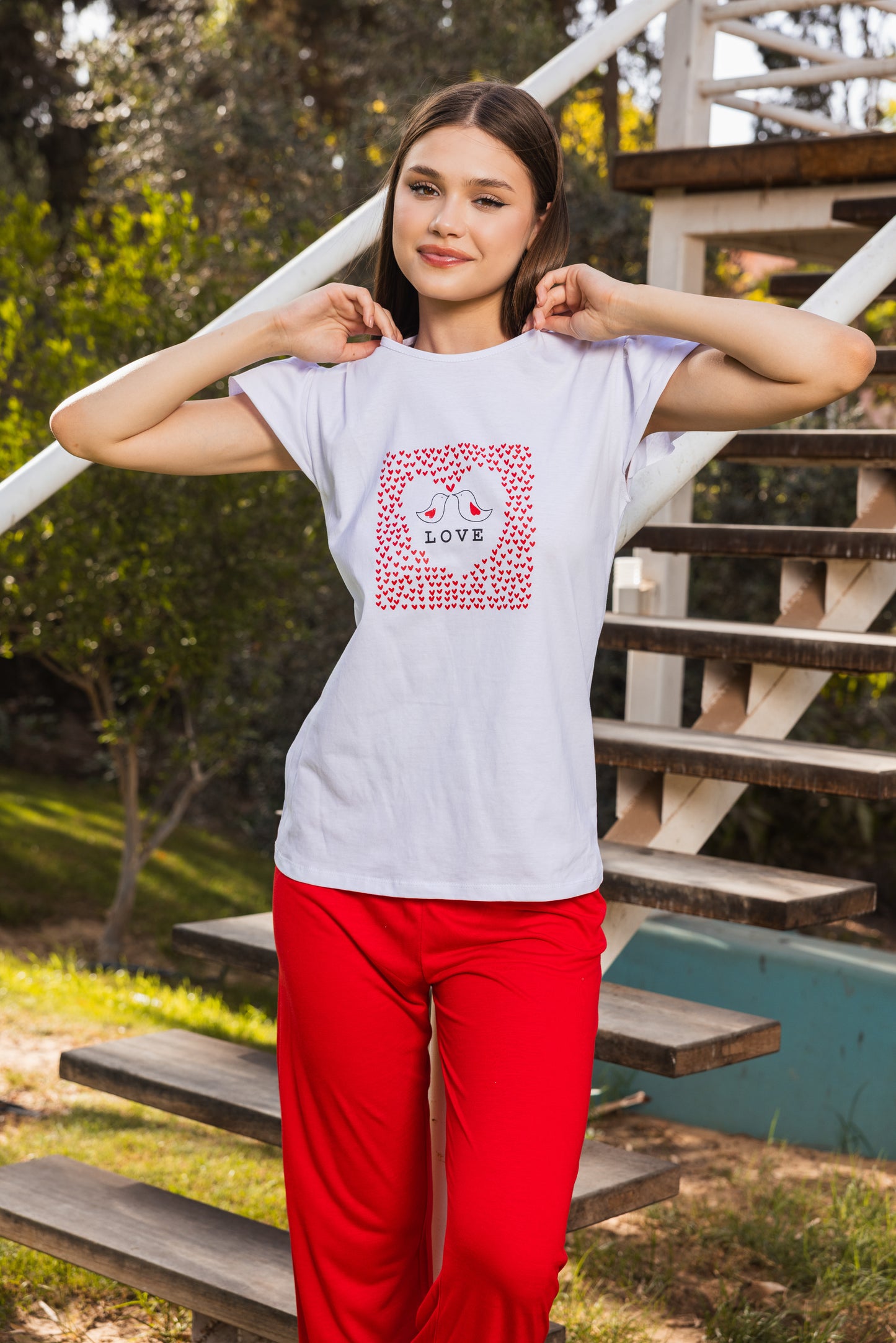 White printed top, plain red pants